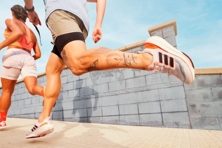 Man and woman running in Adidas UltraBoost Light