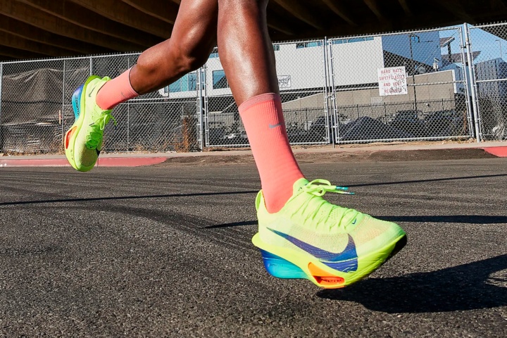 Nike Alphafly 3 running shoes in yellow Volt colorway on feet of runner